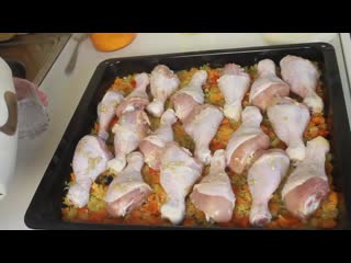 chicken legs with rice and vegetables in the oven, a delicious lunch for the whole family